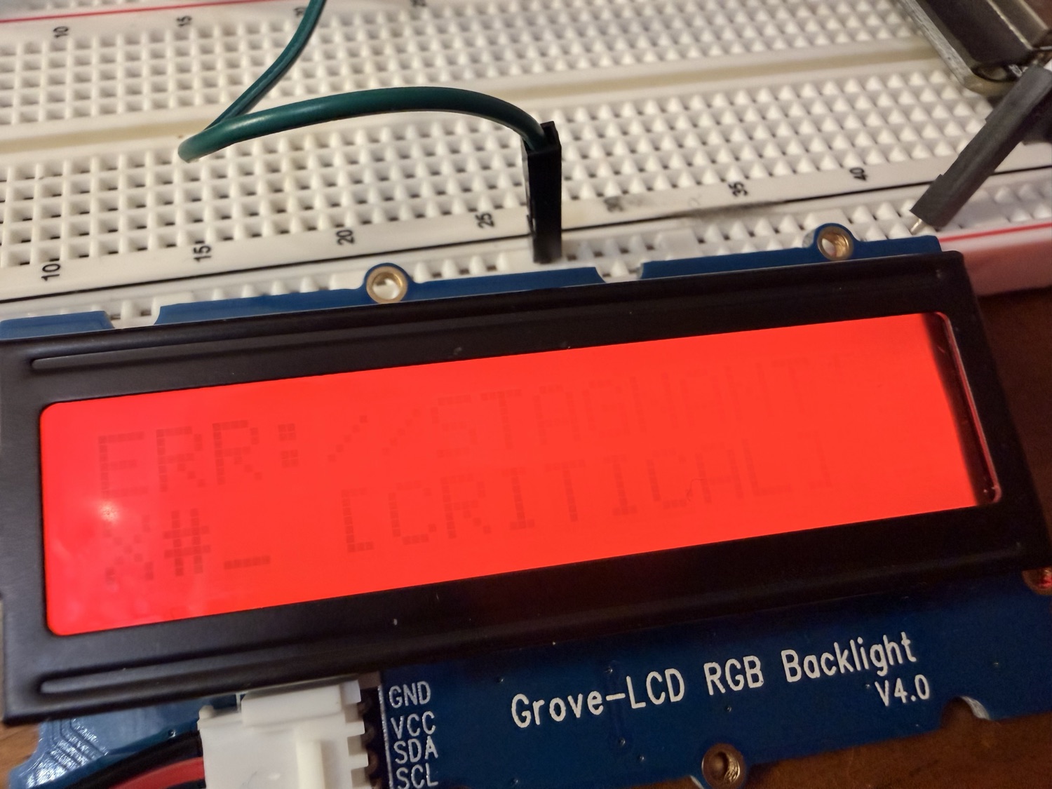 LCD in red alert mode showing a critical error