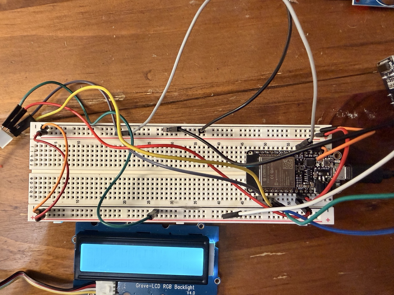 Breadboard with the ESP32 Feather, sensors and LCD